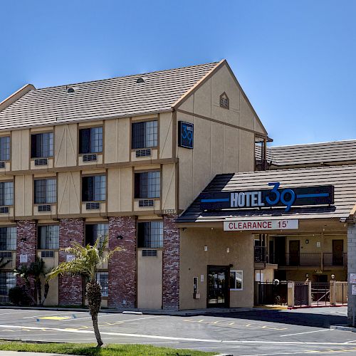 This image shows a multi-story building with a sign reading 